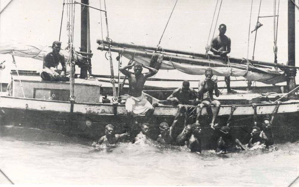 Early aboriginal oyster divers off the Australian coast. Originally pearl diving was done exclusively without equipment because the native oyster population was so plentiful that most oysters were situated in easy to get to locations in shallow waters. The divers primarily were after the oyster shells for their iridescent mother-of-pearl; actual whole pearls were initially considered a bonus find.